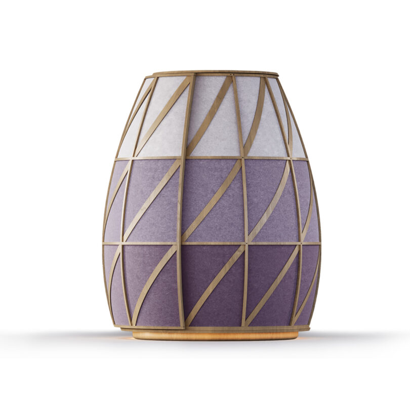 A decorative, vase-shaped object with a wooden geometric frame and panels in shades of white and purple.