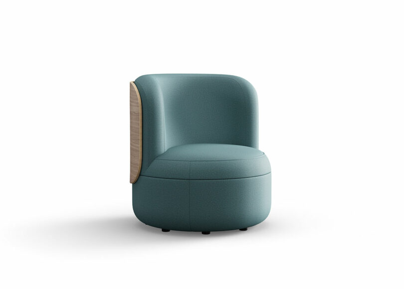 A modern, teal upholstered chair with rounded edges and a partial wooden panel on the back, set against a plain white background.